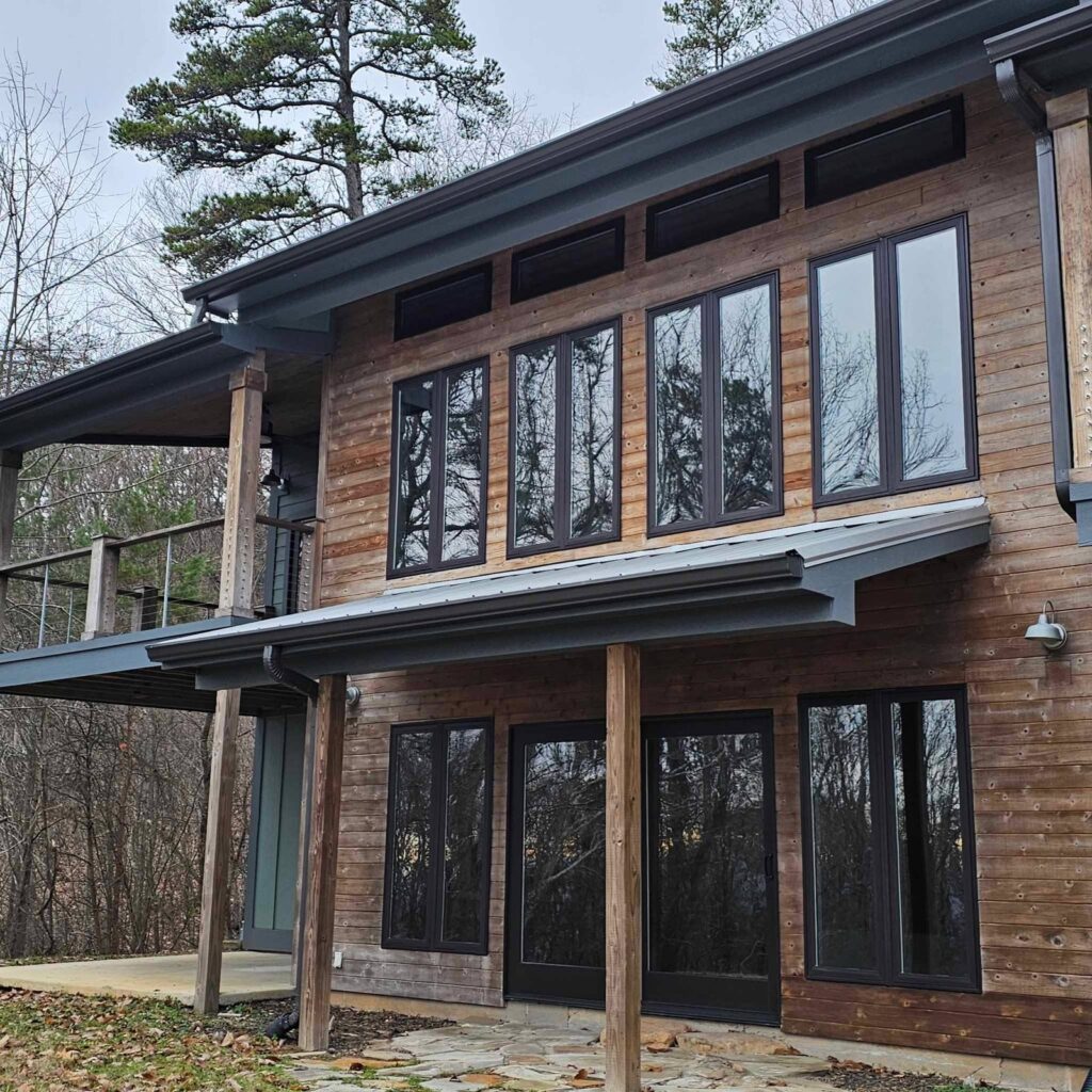 Cedar home in Dunlap, TN with window film on its tall upper and lower windows