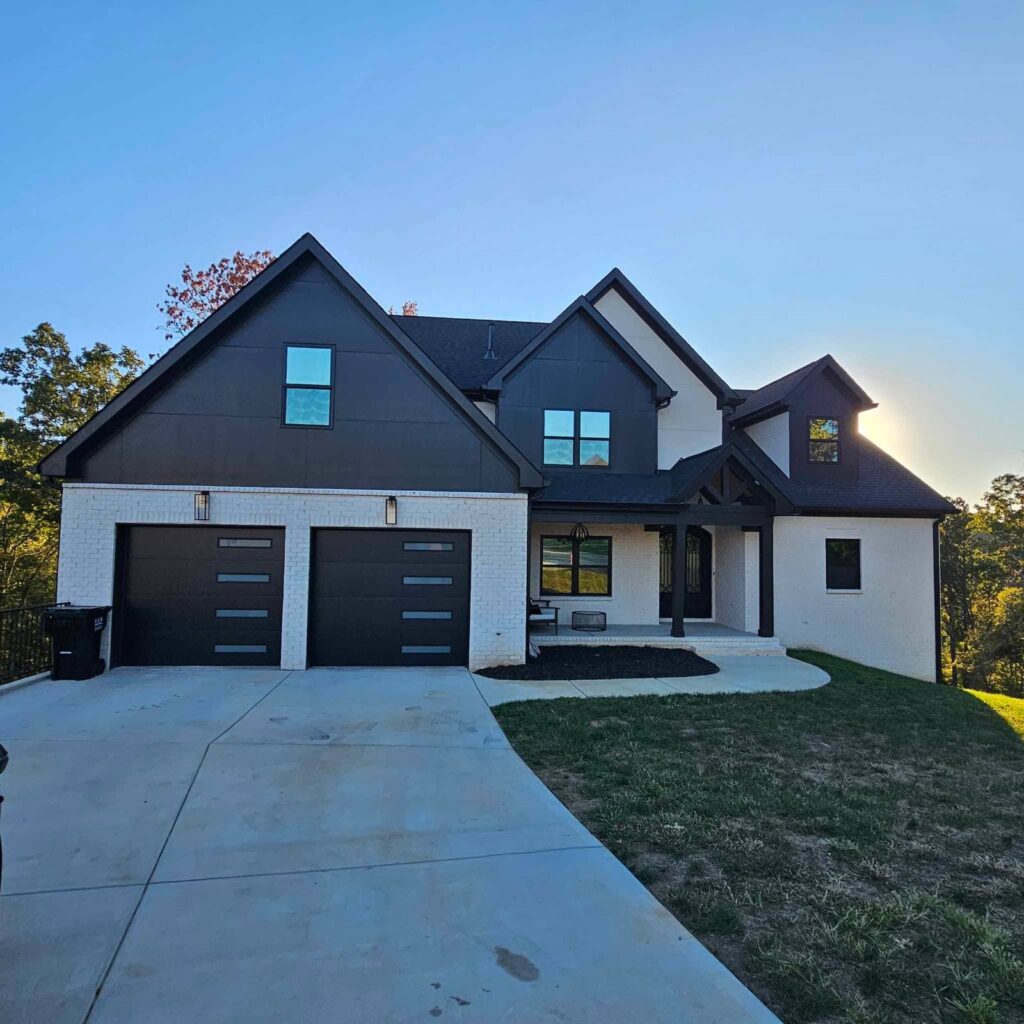 Two-story brick home in Harrison, TN with window film installed on the front windows