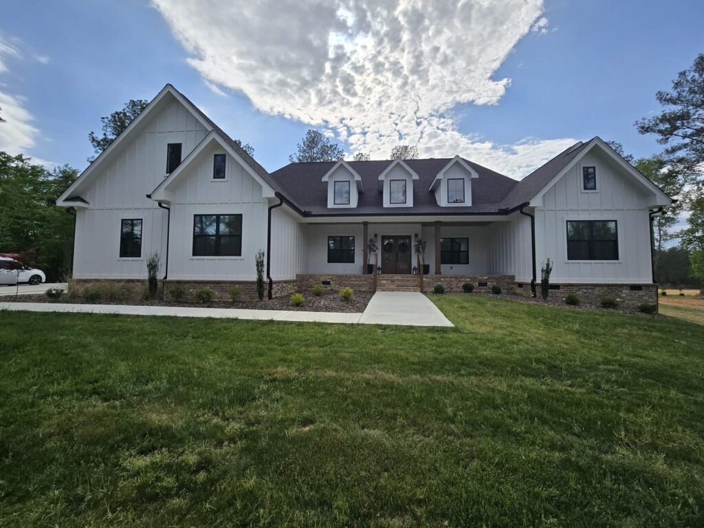White farmhouse-style home in Hixson, TN with residential window film on its front windows