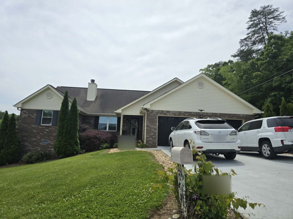 Brick ranch home in Ooltewah, TN with window film on its front windows