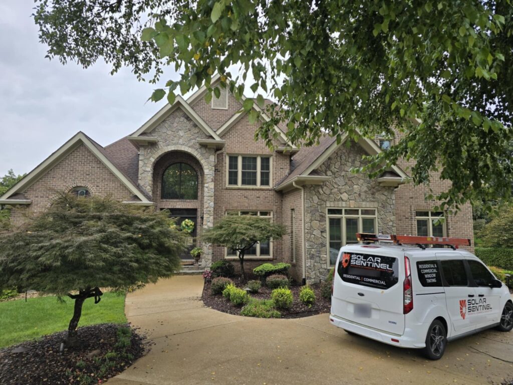 Brick and stone home in East Brainerd, TN with residential window film installed by Solar Sentinel